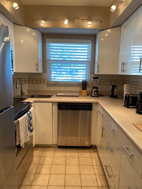 Kitchen w/ stainless steel appliances - 3200 NE 10th St