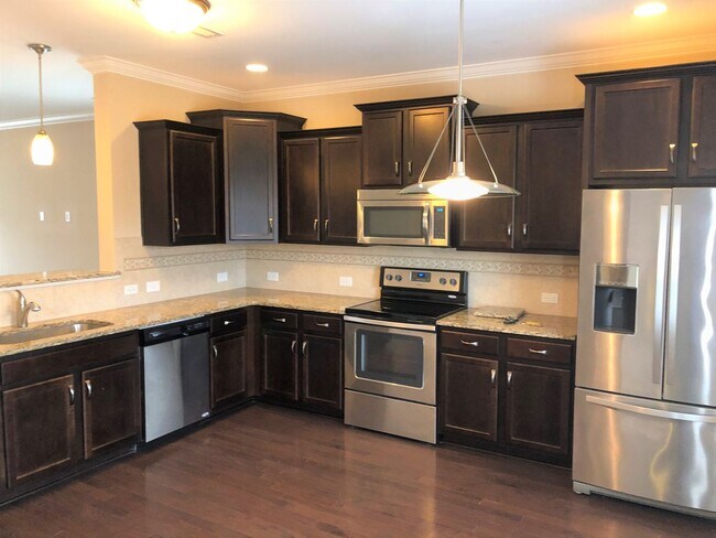 Building Photo - Newer Home, Granite Counter-Tops, Wood Lam...