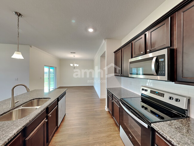 Building Photo - 6614 Hidden Rose Pl