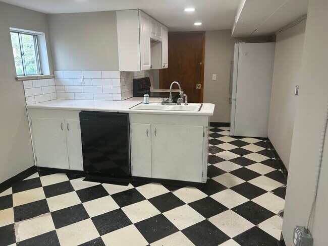 Eat-in kitchen with new electric and paint - 5590 W 1st Ave
