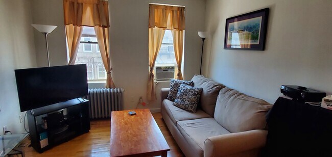 Living Room - Partial View of NYC - 883 Boulevard E