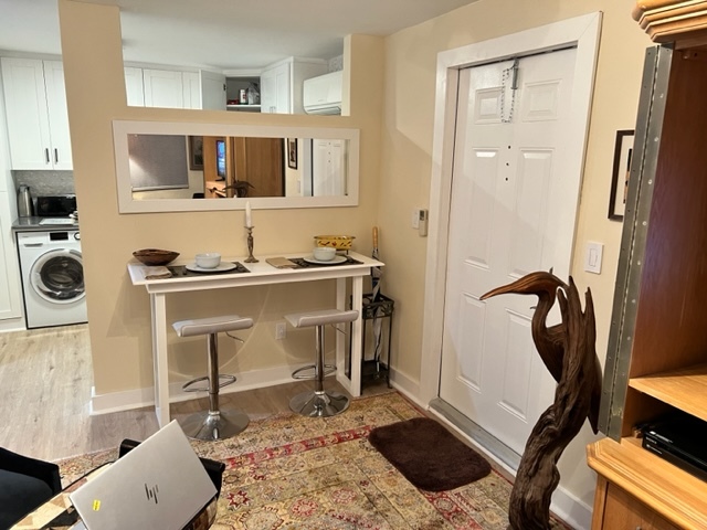 Work station; entrance and dividing wall between living area and kitchen - 2117 NW 2nd Ave