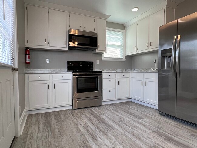 Kitchen - access to back deck - 402 Brandon St