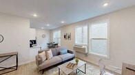 Located at 1528 W Girard Ave in Philadelphia's vibrant Fairmount neighborhood, this well-designed one-bedroom, one-bathroom unit offers a thoughtfully organized layout across a single floor. The open-concept living and kitchen area is bright and welcoming, featuring light wood-style flooring, recessed lighting, and multiple windows that fill the space with natural light. The living area provides comfortable room for both a seating arrangement and a dedicated workspace, making it highly functional for modern living.

The kitchen is a standout feature, boasting white shaker-style cabinetry, a gray subway tile backsplash, light countertops, and a full suite of stainless steel appliances including a refrigerator, electric range, microwave, and dishwasher. A dining area sits adjacent to the kitchen, completing the open living zone.

The bedroom offers a cozy retreat with carpeted flooring, a ceiling fan, a window with room-darkening shades, and a double-door closet providing ample storage. The bathroom features a full tub-shower combination with floor-to-ceiling neutral tile work and a decorative mosaic accent border, lending a clean and polished aesthetic. A separate utility room completes this efficiently laid-out unit.