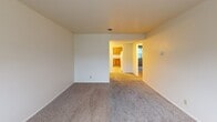 Located at 412 E Glendale Blvd in Valparaiso, Indiana, this single-floor residence offers a practical and functional layout throughout. The living area is generously sized, featuring neutral-toned carpet and clean white walls that create a bright, open atmosphere. Large windows with vertical blinds allow natural light to fill the space while offering views of the surrounding greenery.

The kitchen is well-appointed with warm oak cabinetry providing ample storage, laminate countertops, and tile flooring. White appliances — including a range, over-the-range microwave, dishwasher, and refrigerator — are all included, making the kitchen move-in ready.

The bedrooms are comfortable and carpeted, each featuring large windows with vertical blinds that bring in natural light and provide outdoor views. The rooms offer clean, neutral walls and generous floor space suitable for a variety of furniture arrangements.

The bathroom is finished with tile flooring, a full tub-shower combination, a vanity with a light countertop, and a drop-ceiling with ventilation — maintaining a clean, functional design.

Overall, the space presents a straightforward, well-maintained layout with consistent finishes throughout, offering comfortable single-level living in a residential Valparaiso neighborhood.