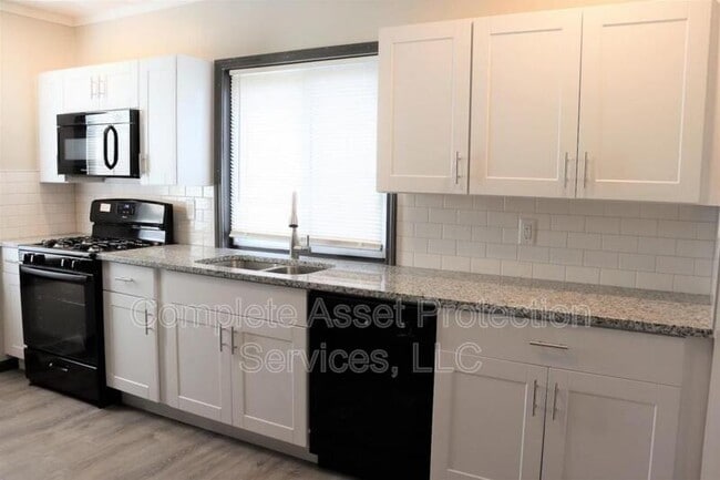 Building Photo - 1649 W 57th Ave