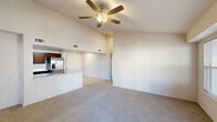 Located on E 121st St S in Broken Arrow, Oklahoma, this single-story, 3-bedroom, 3-bathroom home offers a well-designed layout with a bright and open feel throughout. The main living area impresses with soaring vaulted ceilings and a ceiling fan overhead, creating an airy atmosphere that connects seamlessly to the kitchen via a peninsula-style pass-through counter. The kitchen is well-appointed with rich dark wood cabinetry, marble-style countertops, light tile flooring, a skylight, and a full suite of stainless steel appliances including a refrigerator, range, microwave, and dishwasher. The three bedrooms are carpeted and each features a ceiling fan and natural light from slatted-blind windows. The spacious primary bedroom benefits from multiple windows and generous proportions. Two dedicated closets provide ample storage throughout the home. The three bathrooms are finished with light tile flooring, dark wood vanities, marble-style countertops, and chrome fixtures. One bathroom includes a full tub-shower combination with white tile surround. A connecting hallway ties the living spaces together, completing this clean, modern, move-in-ready home.