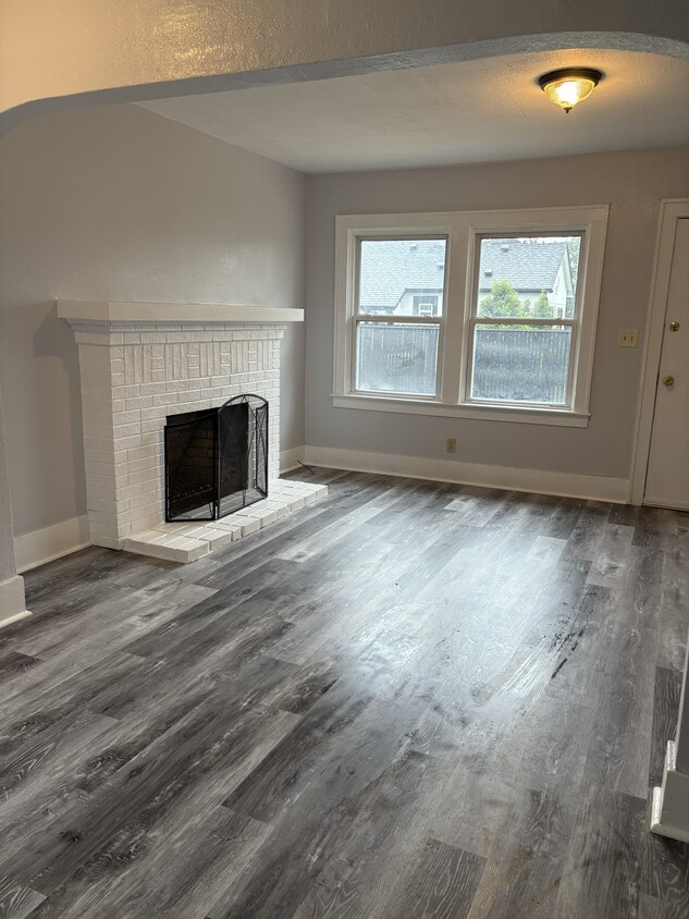 living room with wood burning fireplace - 447 16th St SE
