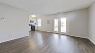 This 760 square foot single-story residence in Louisville, Kentucky offers a well-designed layout with 3 bedrooms and 2 bathrooms. The home features a modern, open-concept living area that combines the kitchen and living room, creating a spacious feel. The kitchen boasts white cabinetry, granite countertops, stainless steel appliances, and a subway tile backsplash, providing both style and functionality.

The primary bedroom, measuring 140 square feet, offers ample space and is complemented by two additional bedrooms. All bedrooms feature neutral carpeting and closet space. The bathrooms have been beautifully renovated with marble-look tile, modern fixtures, and granite countertops.

Throughout the home, you'll find a cohesive design with light gray walls, white trim, and durable wood-look flooring in the main living areas. Large windows in the living room and bedrooms allow for plenty of natural light, enhancing the bright and airy atmosphere. The property also includes a hallway for easy navigation between rooms.

Located at 11707 Nansemond Place in Louisville's 40245 zip code, this home combines modern amenities with a practical layout, making it an ideal choice for those seeking a contemporary living space in a convenient location.