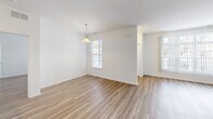 Located on Primrose Lane in Ypsilanti, Michigan, this single-story home offers a well-designed layout with 2 bedrooms and 3 bathrooms. Light-toned wood-look flooring flows throughout the interior, creating a clean and cohesive aesthetic across every room.

The combined living and dining area serves as the heart of the home, anchored by a tile-surround fireplace that adds warmth and character. Large windows allow natural light to fill the space, enhancing its open and airy feel. The kitchen features warm wood cabinetry, dark countertops, and a full suite of black appliances, including a refrigerator, range, and over-the-range microwave.

The primary bedroom is generously sized and includes a walk-in closet outfitted with wire shelving and hanging rods for ample storage. The primary bathroom offers both a standalone shower and a tiled soaking tub with wood-look flooring. The second bedroom is bright and comfortable, with a dedicated closet and a window with natural light. A total of four closets throughout the home provide excellent storage capacity.

A dedicated laundry room houses a full-size washer and dryer with additional shelving. The attached garage features an automatic opener and offers convenient parking and storage. A utility room and entrance area round out this functional and well-appointed home.