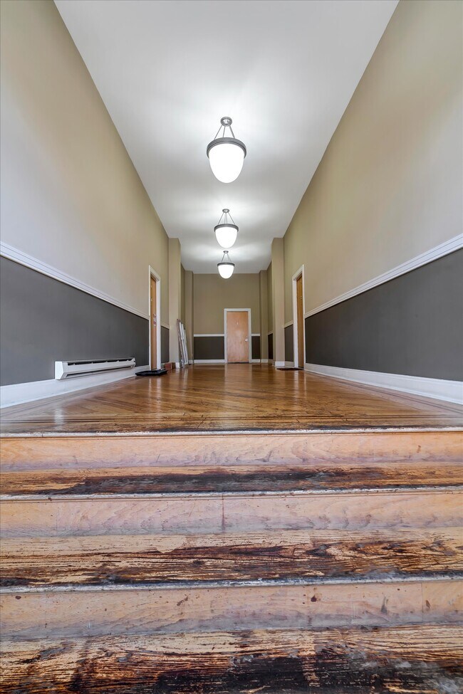 Main Entry Staircase ... #5 is located on the right side of this hallway.. - 2216 Sidney St