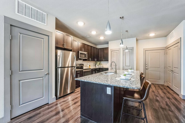 Modern Kitchen with Island & Open Living Room | Discovery Park, Denton TX - Discovery Park Apartments