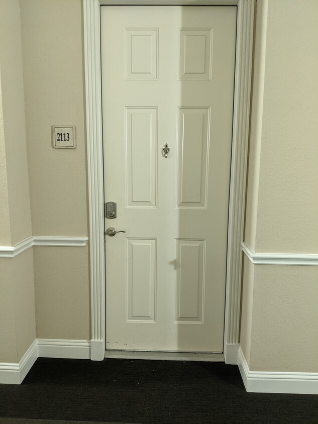 Front door with smart lock - 7575 Kirby Dr