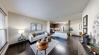 Located at 14700 Woodson Park Dr in Houston, TX, this 1-bedroom, 1-bathroom unit offers a well-designed open-concept layout across a single floor. Rich dark hardwood flooring flows throughout the main living areas, anchoring a bright and welcoming atmosphere with neutral wall tones and clean lines.

The living room is generously proportioned, offering ample space for comfortable seating arrangements and seamlessly connecting to the combined dining area and kitchen. The kitchen is a standout feature, equipped with dark espresso cabinetry, granite countertops, stainless steel appliances — including a refrigerator, microwave, and gas range — and a central island with a built-in sink, ideal for both meal preparation and casual dining.

The bedroom is a comfortable retreat, featuring plush carpeting, a ceiling fan, natural light through a window with blinds, and dedicated closet space. Two closets provide excellent storage throughout the unit. The bathroom is finished with tile flooring, a tub/shower combination, and dark wood cabinetry.

Additional functional highlights include an in-unit laundry area and a welcoming entryway. The overall design balances modern finishes with practical living, making this a well-appointed home in the Houston area.