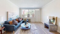 Located at 335 Melvin Ave in Hamilton, Ontario, this well-appointed one-bedroom, one-bathroom unit offers a comfortable and efficiently designed layout across a single floor. The living room is a welcoming space bathed in natural light from a large picture window, featuring crown moulding, light hardwood-style flooring, and a warm, neutral colour palette that creates a relaxed and inviting atmosphere.

The kitchen has been thoughtfully renovated with crisp white shaker-style cabinetry, white subway tile backsplash, light quartz countertops, and a full suite of stainless steel appliances including a fridge, stove, built-in microwave, and dishwasher. Recessed lighting and hardwood-style flooring complete the clean, modern aesthetic.

The bedroom is a comfortable and quiet retreat, featuring crown moulding, a window with natural views of surrounding greenery, and a closet with white panel doors. The bathroom is finished with classic white subway tile surrounding a full soaker tub and shower, paired with a grey vanity and a framed mirror, offering a clean and timeless design.

A private balcony extends the living space outdoors, providing views of the surrounding neighbourhood and green spaces. This unit combines practical updates with a comfortable living environment in a residential Hamilton community.