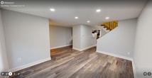 This contemporary townhouse in Fairfax, VA offers 1350 square feet of living space spread across two floors. The home features three bedrooms, including a generous 230 square foot primary suite, and three full bathrooms. The main level showcases an open-concept design, combining the living room, dining area, and kitchen into a cohesive space. The kitchen is a highlight, boasting dark wood cabinetry, granite countertops, and stainless steel appliances. Throughout the home, modern finishes are evident, including recessed lighting, neutral paint colors, and a mix of flooring types. The living areas feature stylish wood-look flooring, while bedrooms are carpeted for comfort. Large windows, including a bay window in one room, allow for ample natural light. Bathrooms are updated with contemporary fixtures and finishes, including granite vanity tops. The home's layout is efficient, with a staircase connecting the two floors and providing easy access to all areas of the residence. This townhouse offers a blend of style and functionality, ideal for modern living in a prime Fairfax location.