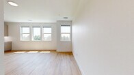 Located at 2735 Mountain Brook Dr in Longmont, CO, this single-floor unit offers a well-designed layout comprising one bedroom, one bathroom, and a closet. The main living area features light-toned hardwood-style flooring that contributes to a bright, airy feel, with natural light streaming in through multiple windows. Recessed lighting and clean white walls throughout create a fresh, contemporary atmosphere.

The generously sized bedroom is finished with neutral wall-to-wall carpeting, providing a comfortable and quiet retreat. Its crisp white walls and ample floor space offer flexibility for a variety of furniture arrangements. A dedicated closet adds practical storage within the unit.

The bathroom showcases modern design details, including a white shaker-style vanity with a sleek white countertop, a bold navy-framed mirror, and matte black fixtures and hardware. Warm hardwood-style flooring carries into the bathroom, while a tiled shower enclosure and clean white walls complete the polished look.

Overall, the unit presents a cohesive, contemporary aesthetic with a neutral color palette, quality finishes, and a practical single-level floor plan — well-suited for those seeking a clean, move-in-ready space in the Longmont, Colorado area.
