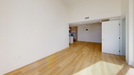 Located at 12078 Guerin St in Studio City, Los Angeles, this single-story, 3-bedroom, 2-bathroom home offers a clean, modern aesthetic with thoughtful design details throughout. Light wood flooring flows seamlessly across the entire residence, complemented by crisp white walls and recessed lighting that create a bright, airy atmosphere.

The open-concept living and dining area is generously proportioned, featuring soaring ceilings and abundant natural light. It connects directly to the contemporary kitchen, which is equipped with warm wood cabinetry, a white center island with pendant lighting, stainless steel appliances, and a subway tile backsplash. An in-unit stacked washer and dryer is conveniently tucked nearby.

The primary bedroom is spacious and sun-filled, highlighted by floor-to-ceiling sliding glass doors that open to an outdoor space, along with a transom window that draws in additional light. The home includes five closets throughout, offering exceptional storage.

Both bathrooms are elegantly finished with large-format tile flooring and full tub-shower combinations enclosed by sliding glass doors. One bathroom features warm wood vanity cabinetry, while the other offers a bright white vanity with a window for natural light. Two hallways connect the living areas to the private bedrooms, providing a well-organized and functional floor plan.