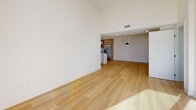Located at 12078 Guerin St in Studio City, Los Angeles, this single-story, 3-bedroom, 2-bathroom home offers a clean, modern aesthetic with thoughtful design details throughout. Light wood flooring flows seamlessly across the entire residence, complemented by crisp white walls and recessed lighting that create a bright, airy atmosphere.

The open-concept living and dining area is generously proportioned, featuring soaring ceilings and abundant natural light. It connects directly to the contemporary kitchen, which is equipped with warm wood cabinetry, a white center island with pendant lighting, stainless steel appliances, and a subway tile backsplash. An in-unit stacked washer and dryer is conveniently tucked nearby.

The primary bedroom is spacious and sun-filled, highlighted by floor-to-ceiling sliding glass doors that open to an outdoor space, along with a transom window that draws in additional light. The home includes five closets throughout, offering exceptional storage.

Both bathrooms are elegantly finished with large-format tile flooring and full tub-shower combinations enclosed by sliding glass doors. One bathroom features warm wood vanity cabinetry, while the other offers a bright white vanity with a window for natural light. Two hallways connect the living areas to the private bedrooms, providing a well-organized and functional floor plan.