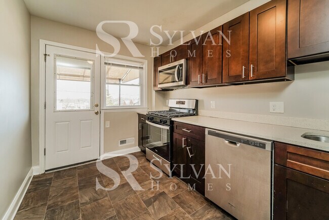 Building Photo - The living is easy in this 4 bedroom, 2 ba...