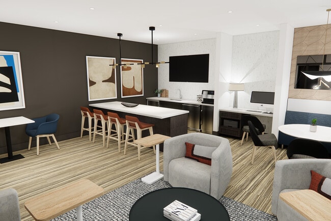 New resident lounge features comfortable seating, entertainment kitchen, &amp; work from home areas - Studio LoHi Apartments