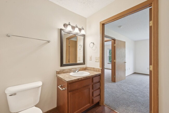 Dooley's Orchard unit showing a master bedroom and bathroom. - Dooley's Orchard