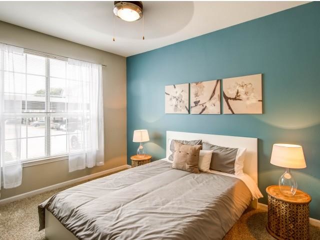 Master Bedroom with ceiling fan and lots of natural light - The Pavilions