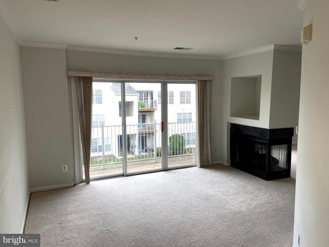 Building Photo - Welcome to this beautifully appointed two level upper condominium that combines modern style with...