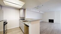 This contemporary 900 square foot apartment in Los Angeles offers a well-designed living space with two bedrooms and two bathrooms. The open-concept floor plan seamlessly integrates the living room and kitchen, creating a spacious feel. The kitchen is equipped with modern appliances, including a stainless steel refrigerator and gas range, complemented by sleek white cabinetry and granite countertops.

Both bathrooms feature updated fixtures, including vanities with granite countertops and tiled shower/tub combinations. The primary bedroom, measuring 170 square feet, provides ample space and includes a closet for storage.

Throughout the apartment, light-toned wood-look flooring enhances the bright and airy ambiance, while large windows allow natural light to flood the space. A private balcony offers an outdoor extension of the living area, perfect for enjoying the Southern California climate.

The property's location at 1335 N La Brea Ave places residents in a vibrant Los Angeles neighborhood, offering easy access to local amenities and attractions. With its modern finishes and thoughtful layout, this apartment provides a comfortable and stylish urban living experience.