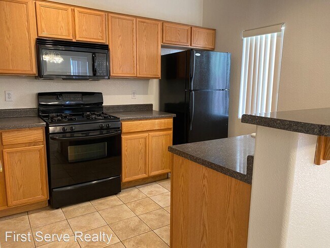 Building Photo - 3 br, 2.5 bath House - 6316 Desert Leaf Un...