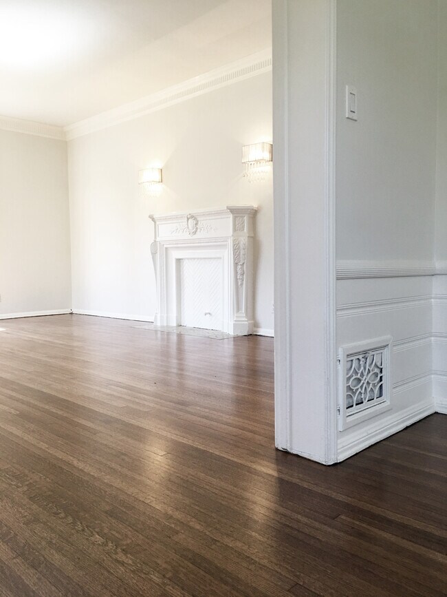 Faux fireplace & mantle, west wall of living room. - 1207 S Alfred St