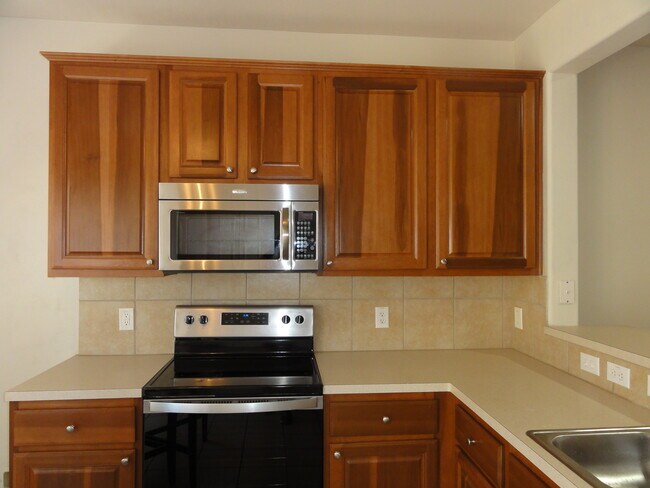 Kitchen equipped with Whirlpool appliances. - 1829 Kemah Village Dr