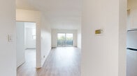 This well-appointed one-bedroom, one-bathroom unit is located on the fifth floor at 36 River Rd E in Kitchener, Ontario. The layout makes efficient use of space across a single floor, connecting the living room, kitchen, bedroom, and bathroom in a logical and practical flow.

The living room is a bright, open area finished with light wood-tone laminate flooring and crisp white walls. A large sliding glass door leads directly to a private balcony, filling the space with natural light and offering views of the surrounding neighbourhood and greenery. The same flooring runs consistently throughout the unit, creating a cohesive and clean aesthetic.

The kitchen is thoughtfully designed with white shaker-style cabinetry, dark countertops, and a white subway tile backsplash. Stainless steel appliances — including a refrigerator, dishwasher, and range — complete the space, offering both function and a modern look.

The bedroom is a comfortable, well-lit room featuring a large window with open sky views and a sliding double-door closet with clean white panel doors. Its neutral palette provides a calm, restful atmosphere.

The bathroom is finished with classic white subway tile surrounding a full soaker tub with a shower, complemented by chrome fixtures, maintaining the unit's clean and modern aesthetic throughout.