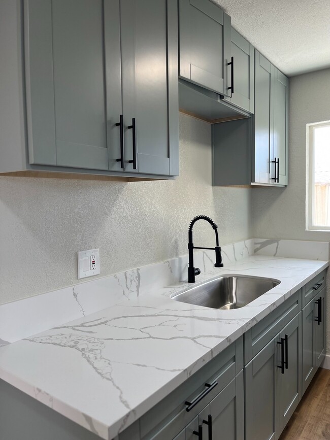 Kitchen Sink and Cabinets - 1622 Una St