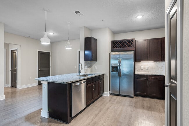 Cook, dine, and gather in a stylish kitchen space. - Cue