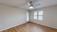 Located at 1500 Willow Trail Dr in Norcross, GA, this well-appointed one-bedroom, one-bathroom residence offers a thoughtfully designed single-floor layout. The open-concept living, dining, and kitchen area serves as the heart of the home, featuring warm hardwood-style flooring that flows throughout. The living room is highlighted by a classic fireplace with a wood mantel and tile surround, a ceiling fan with light, and a sliding glass door that opens to a private balcony, allowing natural light to fill the space. An additional window further brightens the room.

The kitchen is equipped with stainless steel appliances — including a refrigerator, range, and microwave — white shaker cabinetry, a subway tile backsplash, and a peninsula with a white countertop and undermount sink, ideal for casual dining or meal prep.

The spacious primary bedroom includes a ceiling fan, closet access, and its own door leading to an outdoor area. The full bathroom features a white vanity with a large framed mirror, and a tub-shower combination. Additional highlights include three closets, an in-unit laundry area, a hallway, and textured ceilings throughout, rounding out this functional and comfortable Norcross residence.
