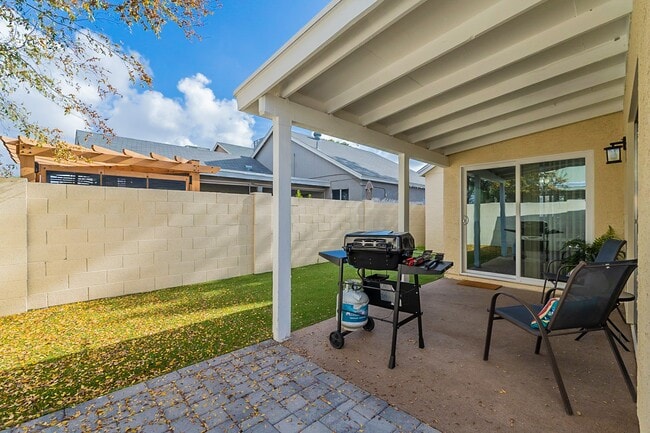 Back patio with seating and BBq grill. - 235 N 22nd Pl