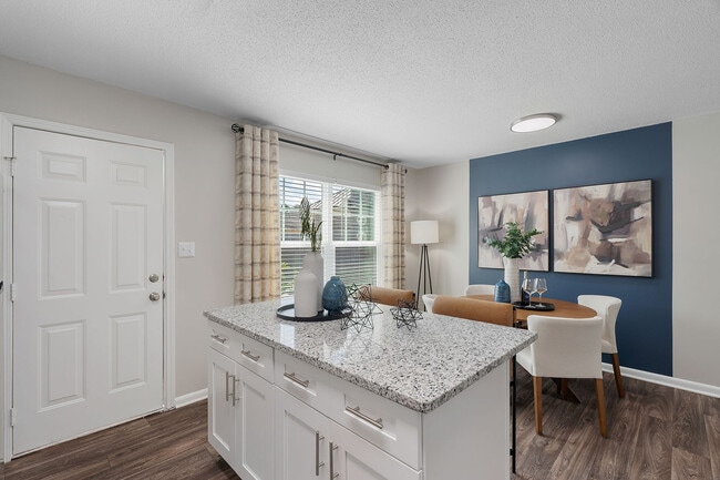 Kitchen Island with granite counters and hardwood style flooring - Blakely