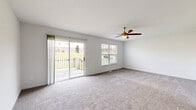 Located at 6 Deer Haven Ct in Florence, Kentucky, this three-bedroom, three-bathroom home spans three well-organized floors, offering a functional and comfortable layout. The ground level houses a spacious garage with room for storage, along with utility areas featuring exposed structural elements and dual windows that bring in natural light.

The main living floor is the heart of the home, featuring an open-concept kitchen and living area. The kitchen is outfitted with gray cabinetry, white countertops, light wood-look vinyl flooring, and stainless steel appliances including a refrigerator and range, complemented by a ceiling fan overhead. The living room continues the bright, airy feel with neutral carpet, a sliding glass door leading to an outdoor deck, and an additional window offering views of the surrounding neighborhood.

A well-appointed bathroom on this level features gray vanity cabinetry, a white countertop, wood-look flooring, and a framed mirror.

The upper floor is dedicated to the bedrooms, each carpeted and filled with natural light. The bedrooms feature ceiling fans, closets, and neutral walls, creating a calm and restful atmosphere. The bathrooms on this level include a tub-shower combination. The generously sized primary bedroom provides a comfortable private retreat. Staircases connect all three levels seamlessly throughout the home.