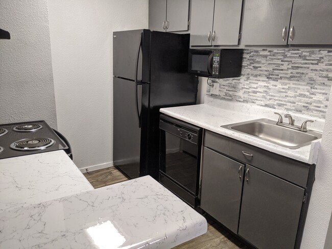 We offer All Black-on-Black Appliances - Treehouse Apartments