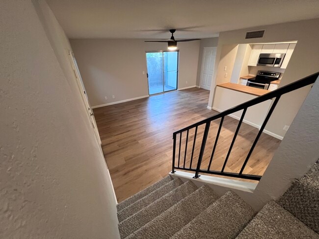 Living room and Kitchen downstairs - 7602 N 61st Ave Apartments