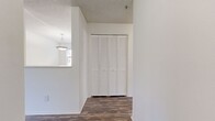 This 820-square-foot apartment in Oviedo, Florida, offers a blend of comfort and modern amenities. The space comprises two bedrooms, two bathrooms, a kitchen, and a living room, all efficiently arranged on a single floor. The kitchen stands out with its contemporary design, featuring white cabinetry, stainless steel appliances, and a built-in microwave. The bathrooms are updated with clean lines and neutral color schemes, including one with a shower/tub combination. The bedrooms, including a 160-square-foot primary bedroom, are carpeted and equipped with ceiling fans and large windows for natural light. The living area boasts wood-look flooring and sliding glass doors leading to an outdoor space. Throughout the apartment, the color palette is predominantly neutral, creating a bright and airy atmosphere. The property also includes closet space for storage. This well-designed layout maximizes the available space, making it an ideal choice for those seeking a modern, low-maintenance living option in a convenient Florida location.