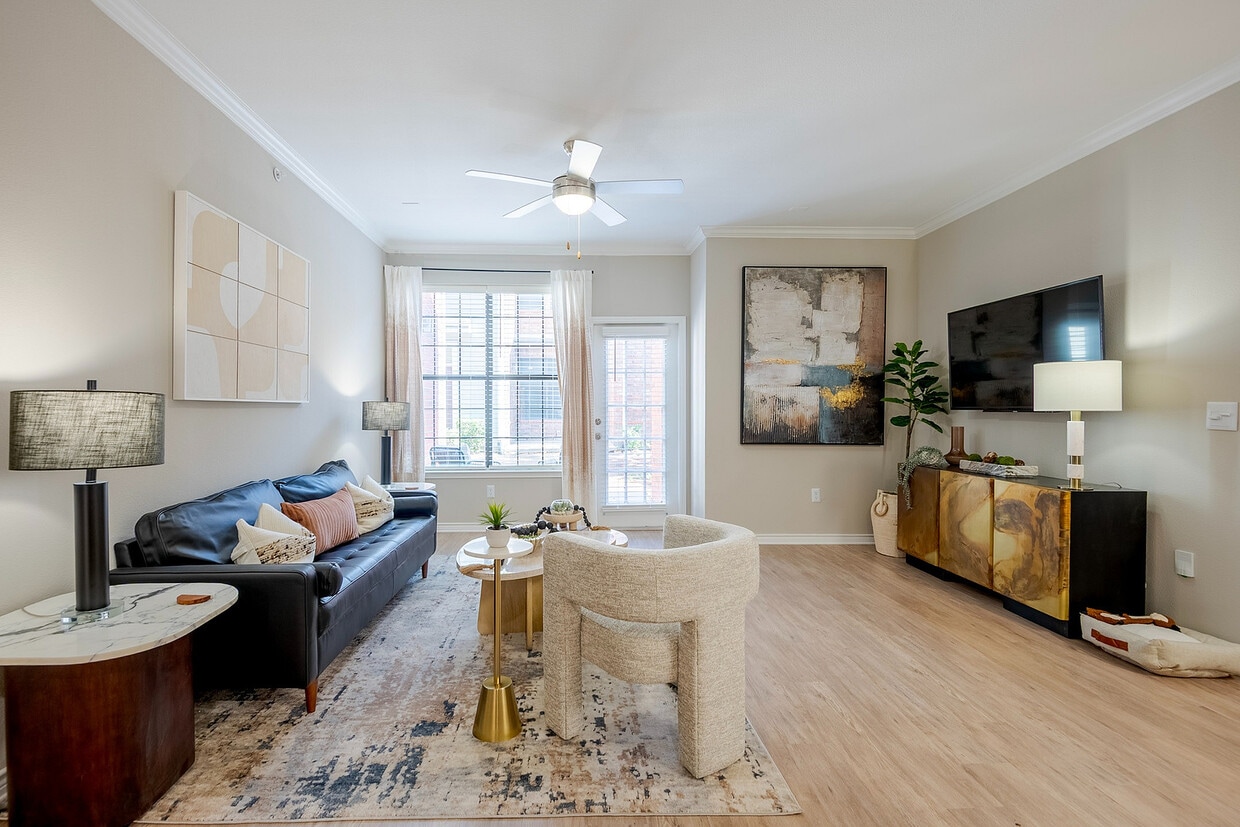 Newly Renovated Living Room with Gorgeous Hardwood Style Flooring - The Delano at North Richland Hills Apartments