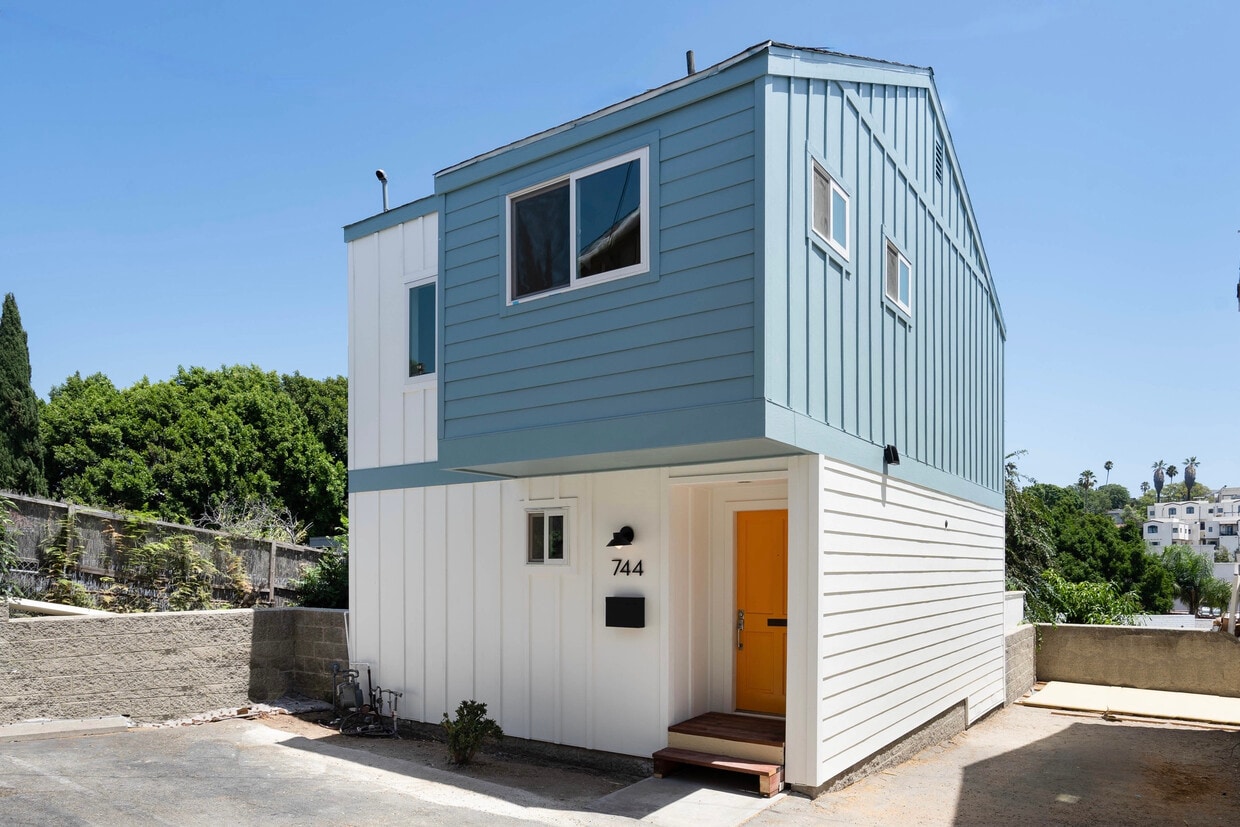Exterior of townhouse. Two tandem parking spaces pictured on right side of photo. - 744 N Dillon St