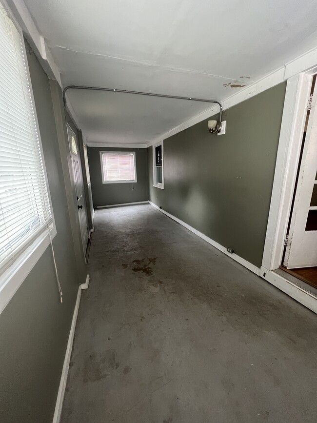 Enclosed front porch offers additional living space - 5103 Forest Ave