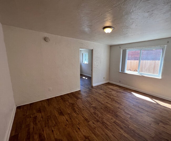 Living room looking at bedroom entrance - 955 16th St Apartments