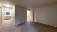 This well-designed 830 square foot apartment in Kirkland, WA offers a comfortable living space with two bedrooms and two bathrooms. The primary bedroom is generously sized at 210 square feet, providing ample space for relaxation. The living area features a cozy fireplace, creating a warm focal point for the room. Large windows throughout allow natural light to flood the space, enhancing the open feel of the apartment. The living room also provides access to a balcony, perfect for enjoying outdoor views. Both bathrooms are equipped with modern fixtures, including a bathtub in one. The apartment features neutral-toned walls and carpeting throughout, creating a versatile backdrop for various decor styles. Baseboard heating ensures comfort year-round. The layout is efficient, with a hallway connecting the various rooms. This single-floor apartment offers a blend of comfort and functionality, ideal for those seeking a low-maintenance living space in a desirable Kirkland location.