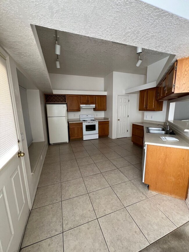 Building Photo - ACADEMY RIDGE 3 Bedroom 2 Bath with 2 car ...