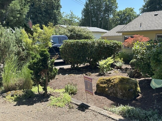 House has deep driveway for two cars and another two car private parking area at street - 16715 SE Evergreen Ln