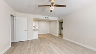Located at 4707 E McDowell Rd in Phoenix, AZ, this single-floor, 2-bedroom, 2-bathroom home offers a well-organized layout designed for comfortable living. Light wood-style flooring flows consistently throughout the space, creating a bright, cohesive aesthetic complemented by neutral warm-beige walls and crisp white baseboards.

The open living area is airy and welcoming, featuring a ceiling fan with light fixture and a textured ceiling. It connects seamlessly to the kitchen, which is outfitted with white shaker-style cabinetry, quartz-style countertops, a classic subway tile backsplash, stainless steel appliances including a refrigerator, dishwasher, and range, as well as a built-in microwave and track lighting overhead.

Both bedrooms are comfortably sized, with the primary bedroom offering dedicated closet space, a ceiling fan, and a window with blinds that brings in natural light. The second bedroom also features a window with blinds, maintaining the same light-filled atmosphere. Each bedroom is served by its own full bathroom, both finished with a tub/shower combination, light wood-style flooring, and white vanity cabinetry. A hallway connects the rooms, keeping the layout functional and private. Two closets provide added storage throughout the home.